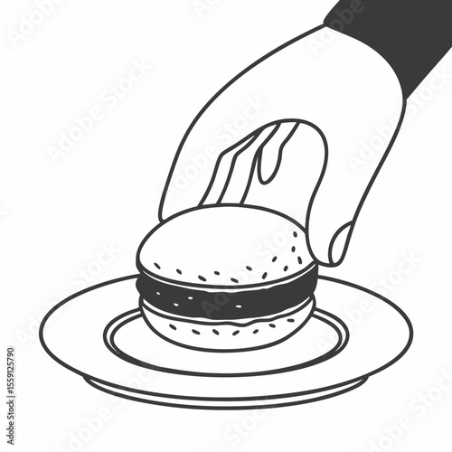 Hand placing macaron on plate dessert sweet