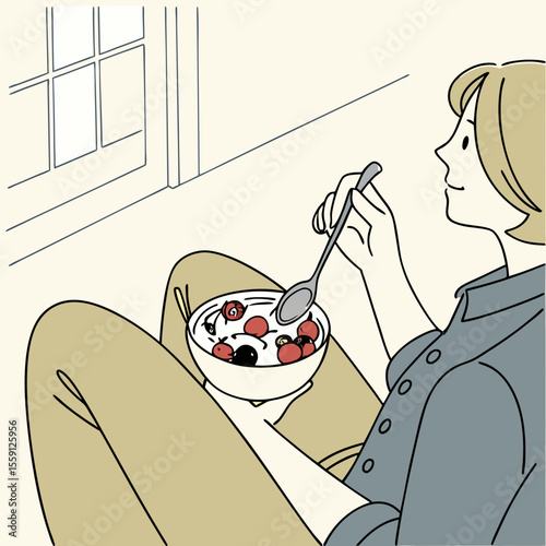 Person enjoying a bowl of yogurt with red berries and blueberries eating