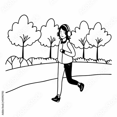 Teenager jogging with headphones in park trees