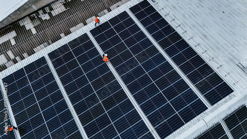 Solar power technician inspecting rooftop solar panels, performing maintenance and installation of renewable energy systems for a sustainable future.