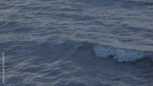 Blue crystal clear water. Perfect seascape in slow motion. Sea wave low angle view. Ocean surface, deep blue water color and waves. Blue waves sea water. ProRes 422 10 bit C-LOG2 video.