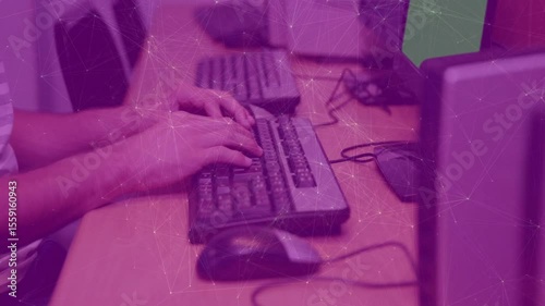 Walking toward desk starting with hands settling on keyboard and typing rapidly to complete report