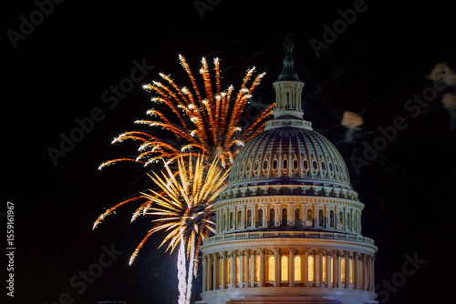 Colorful fireworks burst at night sky above US Capitol dome, creating festive atmosphere for event in Washington D.C
