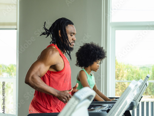 Father dad coach teacher training student kid daughter exercise sport run jogging test body on treadmill machine two people together joy fun in gym fitness class room with love care happy family time.