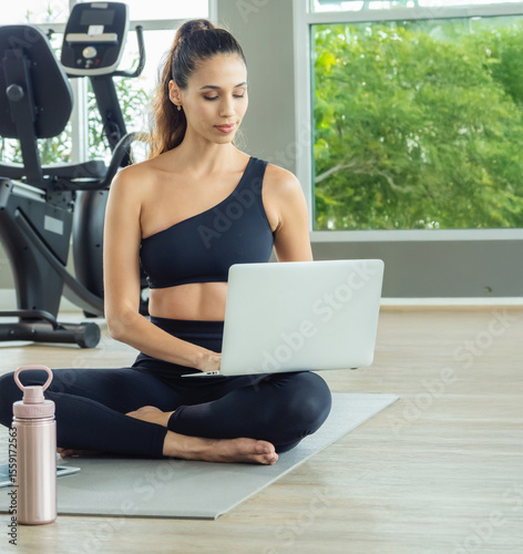 Woman young latin like learn for labtop training active exercise sport test body fit body strong healthy joy fun in indoor gym fitness class room have equipment dumbbell with love care happy day time.