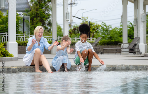 Single mother woman and child daughter sibling carefree smile cheerful leisure activity playing water swimming pool summer fun enjoy relax outdoor travel hotel with love care happy family holiday time