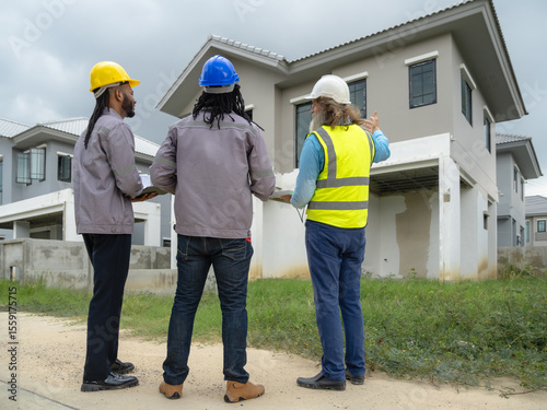 Professional architect and foreman wear head hat talk meeting safety work team check inspection tablet document ergy sorlar panels improvement project plan design home building in construction site.