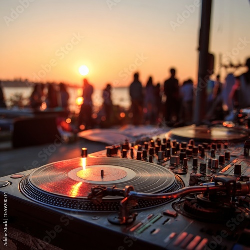 Sunset Beats: Capturing the vibrant energy of a beachside party with a DJ mixing tunes as the sun dips below the horizon, painting the sky with colors and setting the perfect vibe.