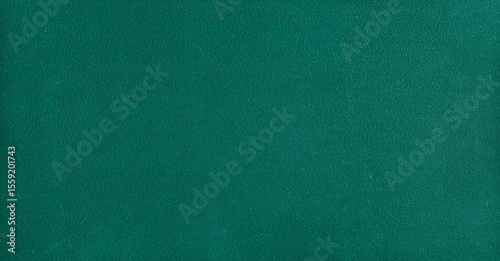 Smooth billiard cloth texture in green, close-up surface view
