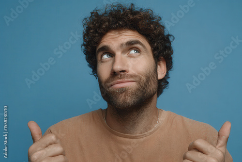 portrait of cunning slacker with sly expression positioned on left side of frame