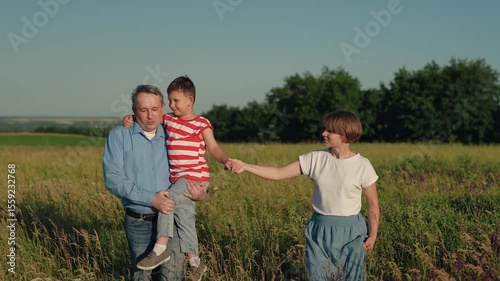 active family lifestyle, happy family park, mother father child son walk park, father mother child travel vacation, smile face, family fun, dad holds his son his arms, father carries his son his arms