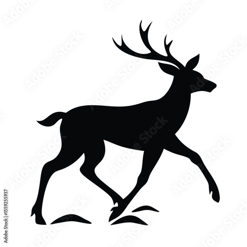Elegant black silhouette of a deer gracefully walking in a natural setting during daylight hours