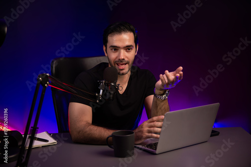 Broadcaster talking to fanclub listener using mic, discussing financial issue any problem in live streaming on with by creative positive thinking concept at purple neon light modern studio. Surmise.
