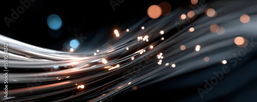 Abstract light trails with sparkling bokeh on black background