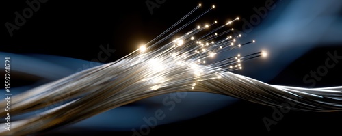 Sparkling fiber optic cables illuminating a dark background