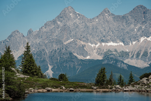 mountain lake (Spiegelsee) in the Austrian alps with Dachstein glacier in the background