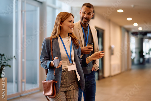 Φωτογραφία Happy businesswoman and her colleague entering in office building