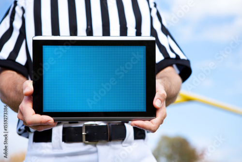 Referee: Holding a Blank Digital Tablet