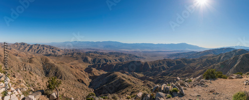 Scenic view from Keys View at Joshua Tree National Park across Little San Bernardino Mountains to Mount San Jacinto, San Andreas Fault and Coachella Valley, California, USA against blue sky