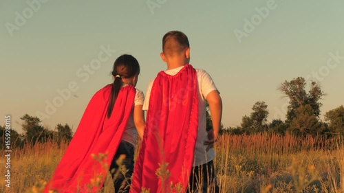 child kid girl boy run sunset, little child winners run park red raincoats, winners children dream success, superhero battle game, children's running, victory family success, kid red raincoat running