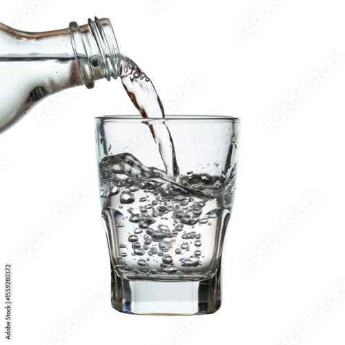 Refreshing water is being poured from bottle into clear glass, creating bubbles and splashes, evoking sense of hydration and vitality