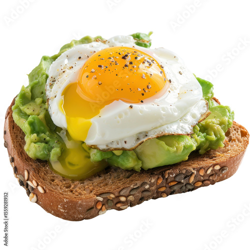 Creamy avocado spread on toasted bread topped with sunny side up egg, garnished with black pepper, creating delicious breakfast dish