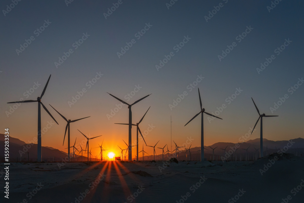 Obraz premium Scenic view of Palm Springs Windmills at Coachella Valley, California, USA at sunset against blue sky