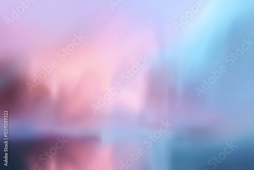Soft Pastel Hues Reflect on a Tranquil Lake at Dawn Surrounded by Distant Sil...