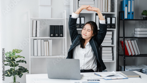 Asian Adult Woman Stretching in Office Relaxation Break Exercise at Desk Wellness Posture Relief Tiredness Ergonomics Healthy Lifestyle