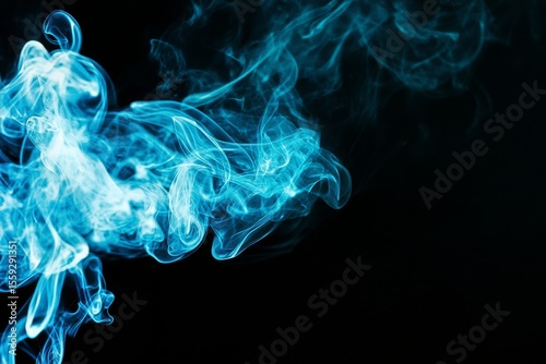 Smoke Swirling in Different Shapes Against a Dark Background Creates an Abstr...