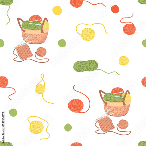 Knitting seamless pattern with skeins of yarn, basket with threads, knitting needles and knitwear. Green, yellow, red, brown colors on white background. Vector cartoon design for textile, wallpaper.
