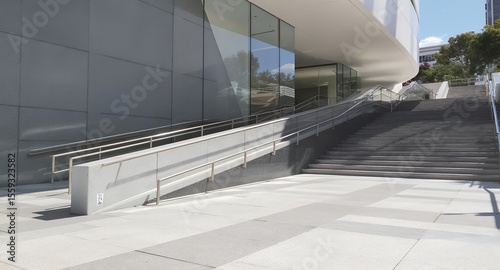 Modern building exterior with stairs and ramp accessible design