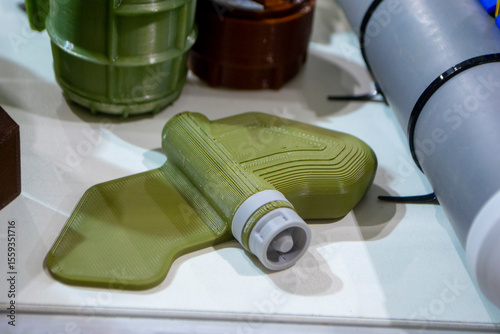 Mina Petal printed on 3D printer. Anti-personnel explosive mine created on 3D printer from molten plastic. Prototype of ammunition printed on 3D printer. Innovation modern new 3d printing technology