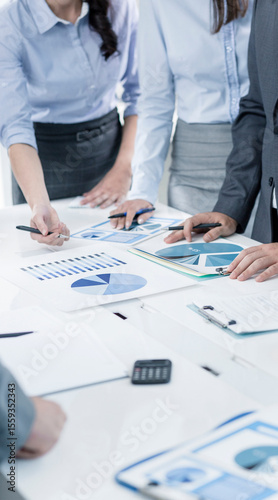 Teamwork Collaboration With Business Charts and Marketing Reports