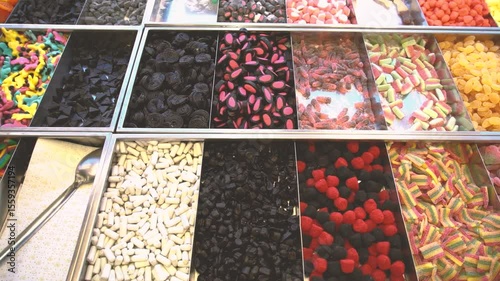 Gummies candy shop market. Lots of gummy candies close up. Muontain of candy inside a market. Lots of colorful candies. Multi flavor kandy. Different shapes fruit candies