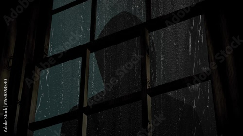 Hooded person looking in window on a rainy night