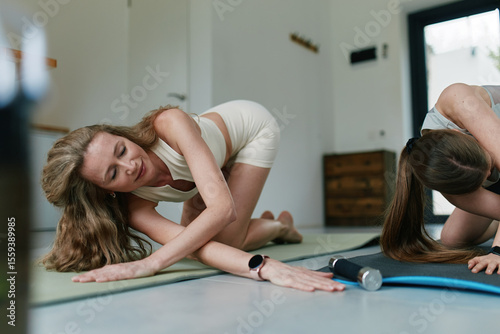 Wallpaper Mural Active middle age woman practicing fitness indoors focusing on wellbeing and healthy lifestyle in bright room Torontodigital.ca
