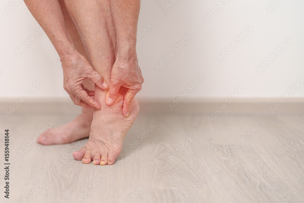 Elderly woman having leg pain due to Ankle Sprains or Achilles Tendonitis and Shin Splints ache. injury, hyperuricemia disease, Gout,Senior Health care and medical treatment concepts Elderly woman having leg pain due to Ankle Sprains or Achilles Tendonitis and Shin Splints ache. injury, hyperuricemia disease, Gout,Senior Health care and medical treatment concepts