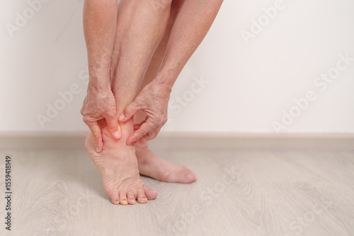 Elderly woman having leg pain due to Ankle Sprains or Achilles Tendonitis and Shin Splints ache. injury, hyperuricemia disease, Gout,Senior Health care and medical treatment  concepts