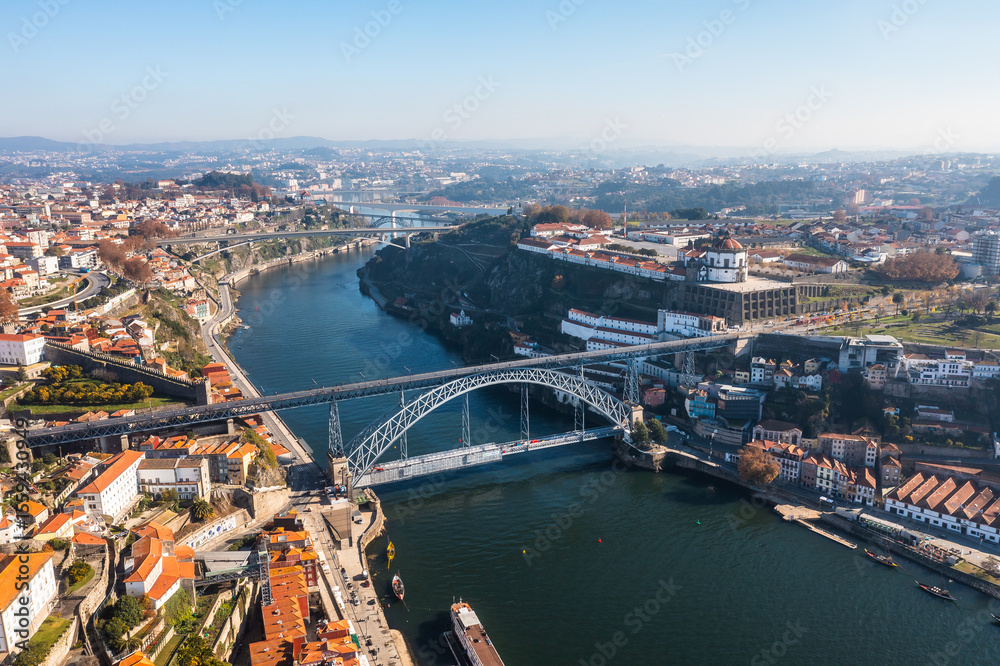 Naklejka premium Cityscape of the city of Porto, including the Douro river and the Dom Luis I bridge (Ponte de Dom Luís I). Porto, Portugal.