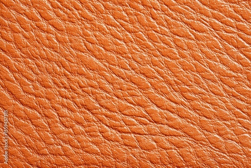 A closeup shows textured orangebrown leather with visible grain patterns creating a dimensional surface