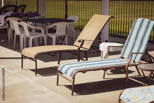 Retro outdoor lounge chairs by pool