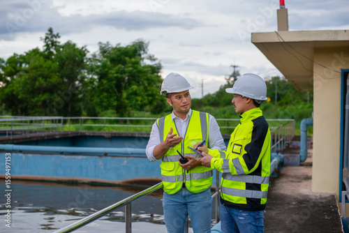 Wastewater treatment plant engineers are working together to inspect the wastewater treatment system for defects in order to improve the system.