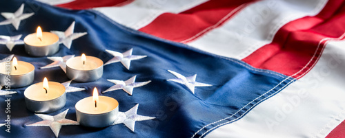 Burning candles on USA flag...