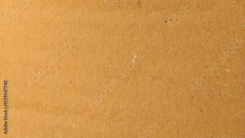 Background of brown kraft paper or cardboard texture. Old vintage paper with a glowing center and grunge vignette.
