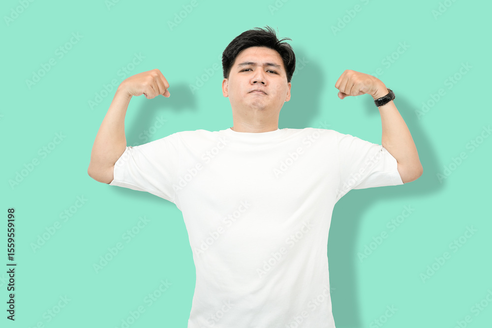 Fototapeta premium Man Flexing Biceps: Asian Man Showing Off Muscles