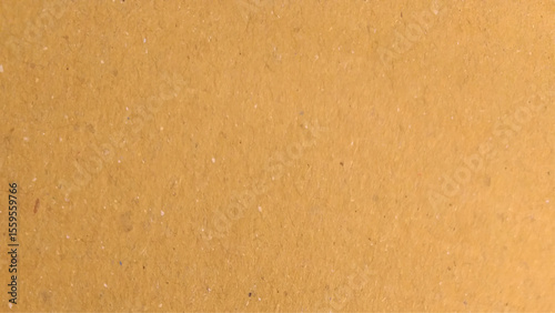 Background of brown kraft paper or cardboard texture. Abstract pattern of beige rough carton, old paper sheet, parchment or papyrus surface.