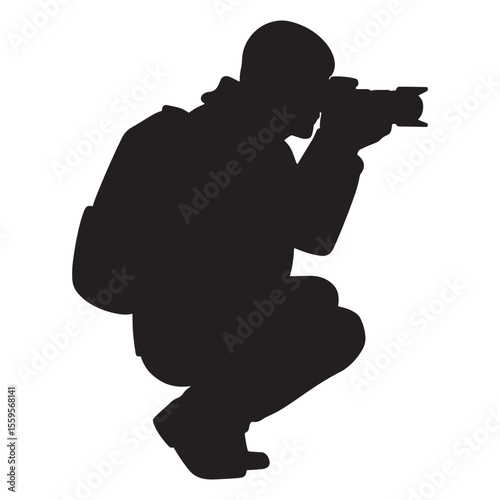 Silhouette of a photographer crouching down capturing a photo with professional camera