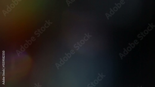 A beautiful, organic, and cinematic light leak and lens flare overlay with colorful rainbow refractions, perfect for adding a dreamy, vintage, or atmospheric effect