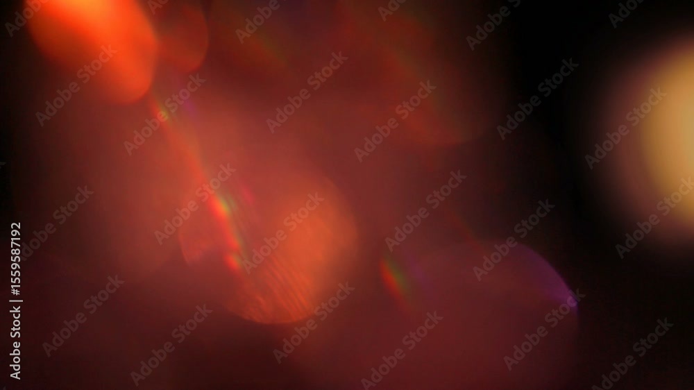 An abstract background image of a warm, organic red and orange light leak and lens flare with beautiful bokeh and cinematic rainbow refractions